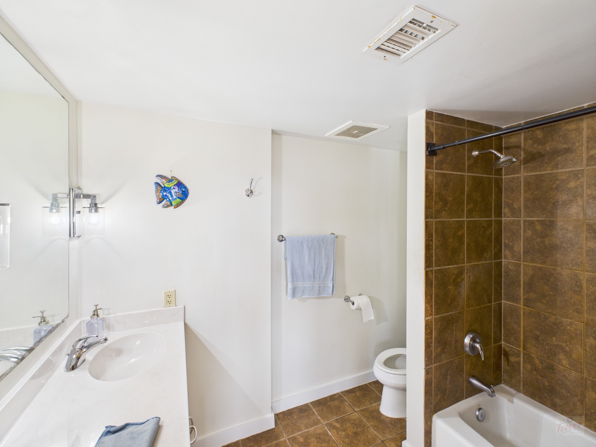 711 West 26th Street, Unit 606 Austin, TX 78705 - Photo 6 of 11 a bathroom with a sink a toilet and shower