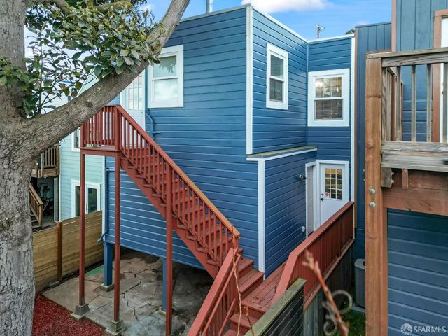 a backyard of a house with seating space