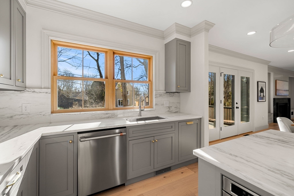 7 Flatley Avenue Manchester, MA 01944 - Photo 13 of 42 a kitchen with a sink stove and cabinets