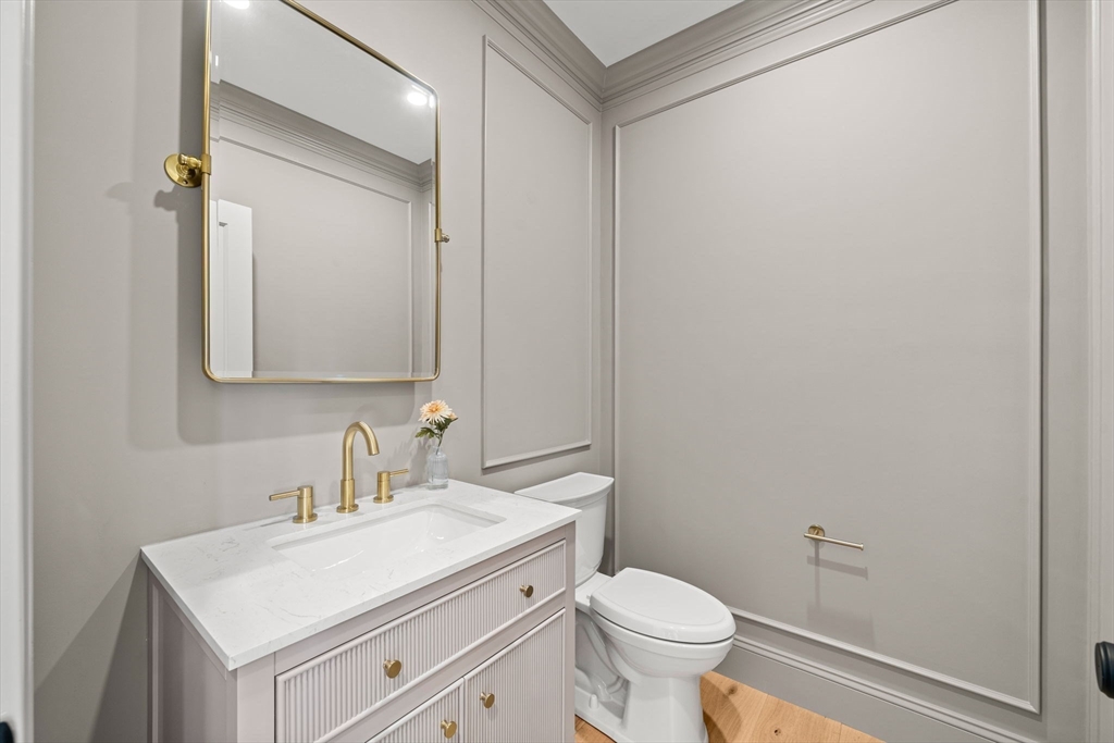 7 Flatley Avenue Manchester, MA 01944 - Photo 16 of 42 a bathroom with a sink toilet and vanity