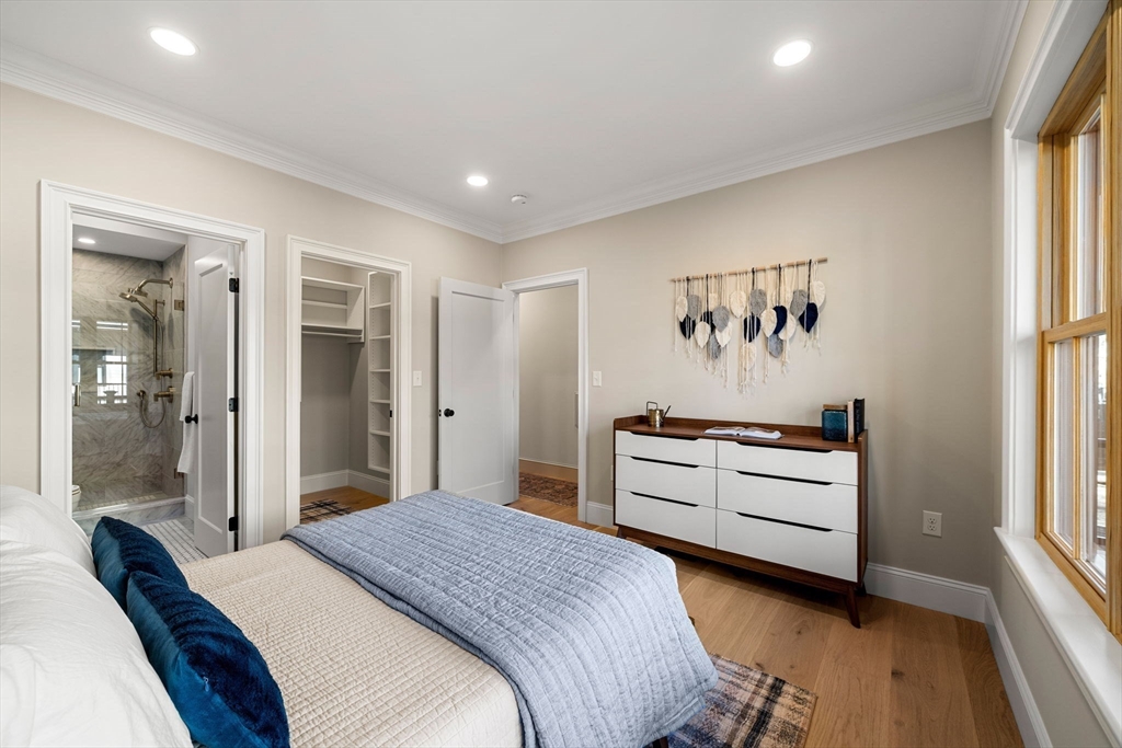 7 Flatley Avenue Manchester, MA 01944 - Photo 17 of 42 a bedroom with a bed and a large window