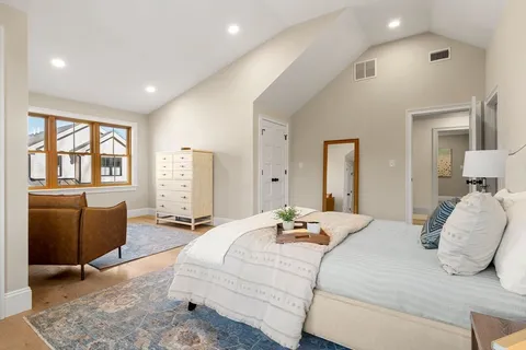 a bedroom with bed and window