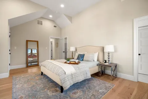 a bedroom with a bed and a lamp