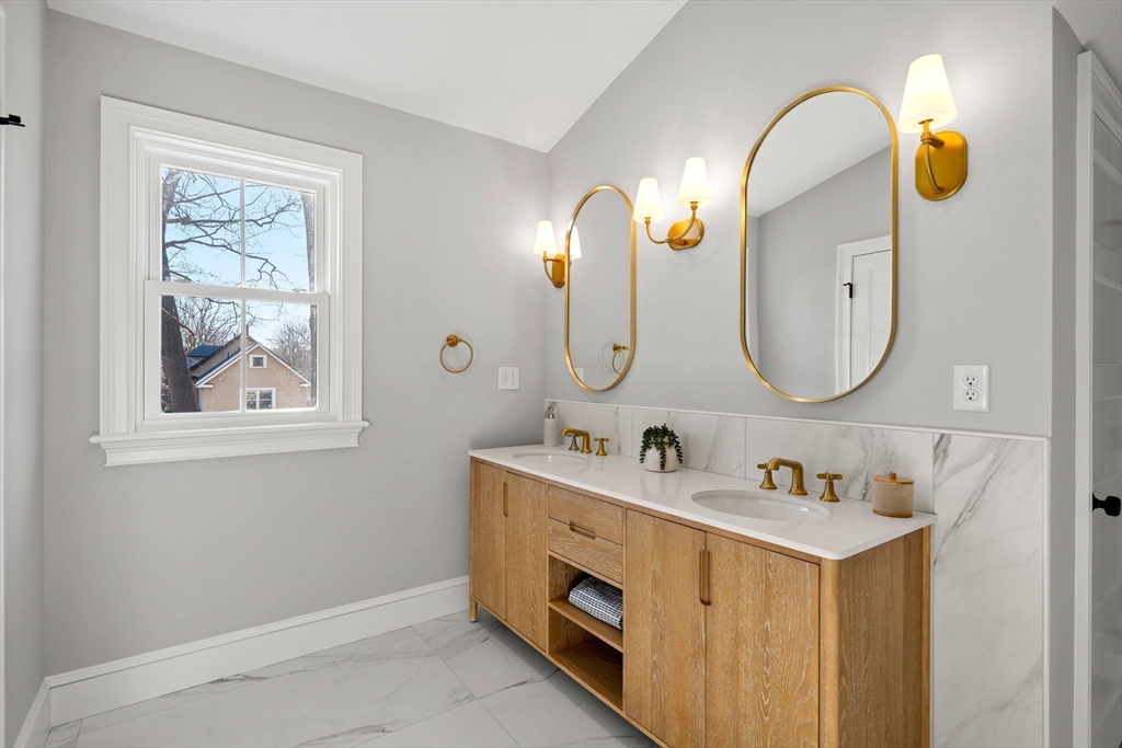 7 Flatley Avenue Manchester, MA 01944 - Photo 26 of 42 a bathroom with a double vanity sink and a mirror