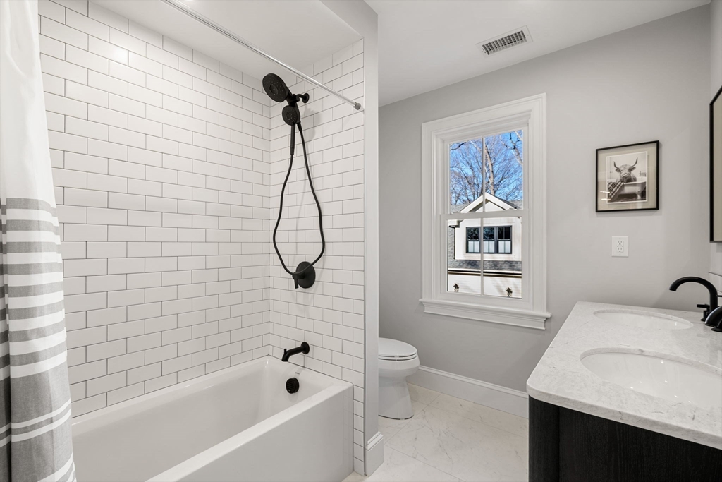 7 Flatley Avenue Manchester, MA 01944 - Photo 29 of 42 a bathroom with a granite countertop sink a toilet and a bathtub