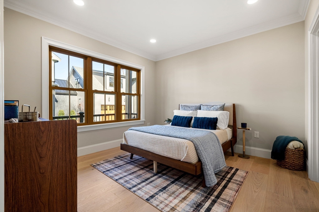 7 Flatley Avenue Manchester, MA 01944 - Photo 33 of 42 a bed room with a bed and a chair