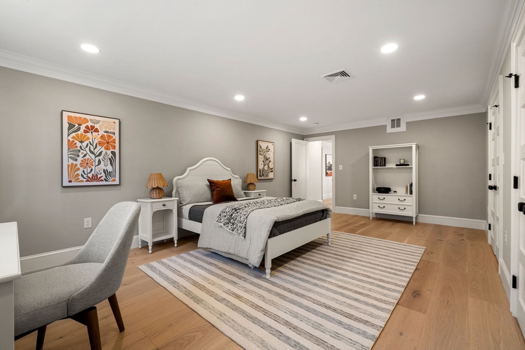 7 Flatley Avenue Manchester, MA 01944 - Photo 38 of 42 a spacious bedroom with a bed and a couch