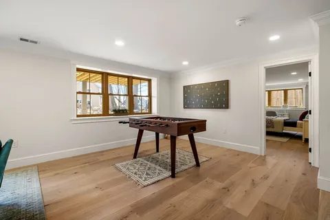 a workspace with furniture window and wooden floor
