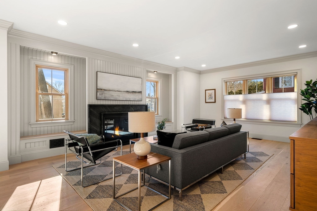 7 Flatley Avenue Manchester, MA 01944 - Photo 5 of 42 a living room with furniture a fireplace and a window