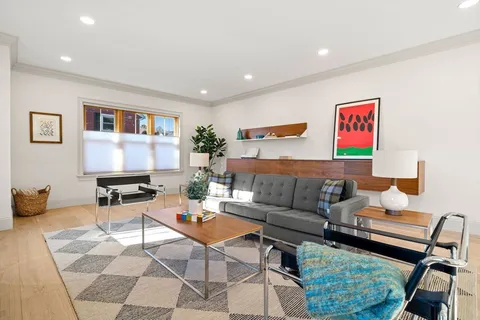 a living room with furniture and a rug