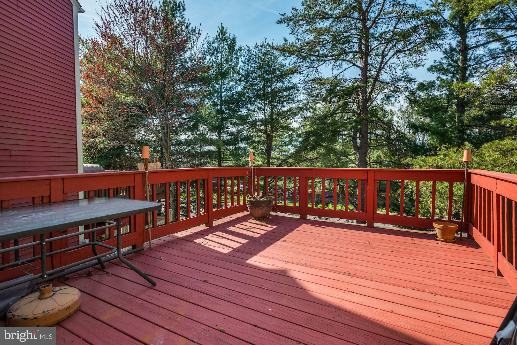 1704 Quietree Drive Reston, VA 20194 - Photo 11 of 23 a balcony with wooden floor and fence