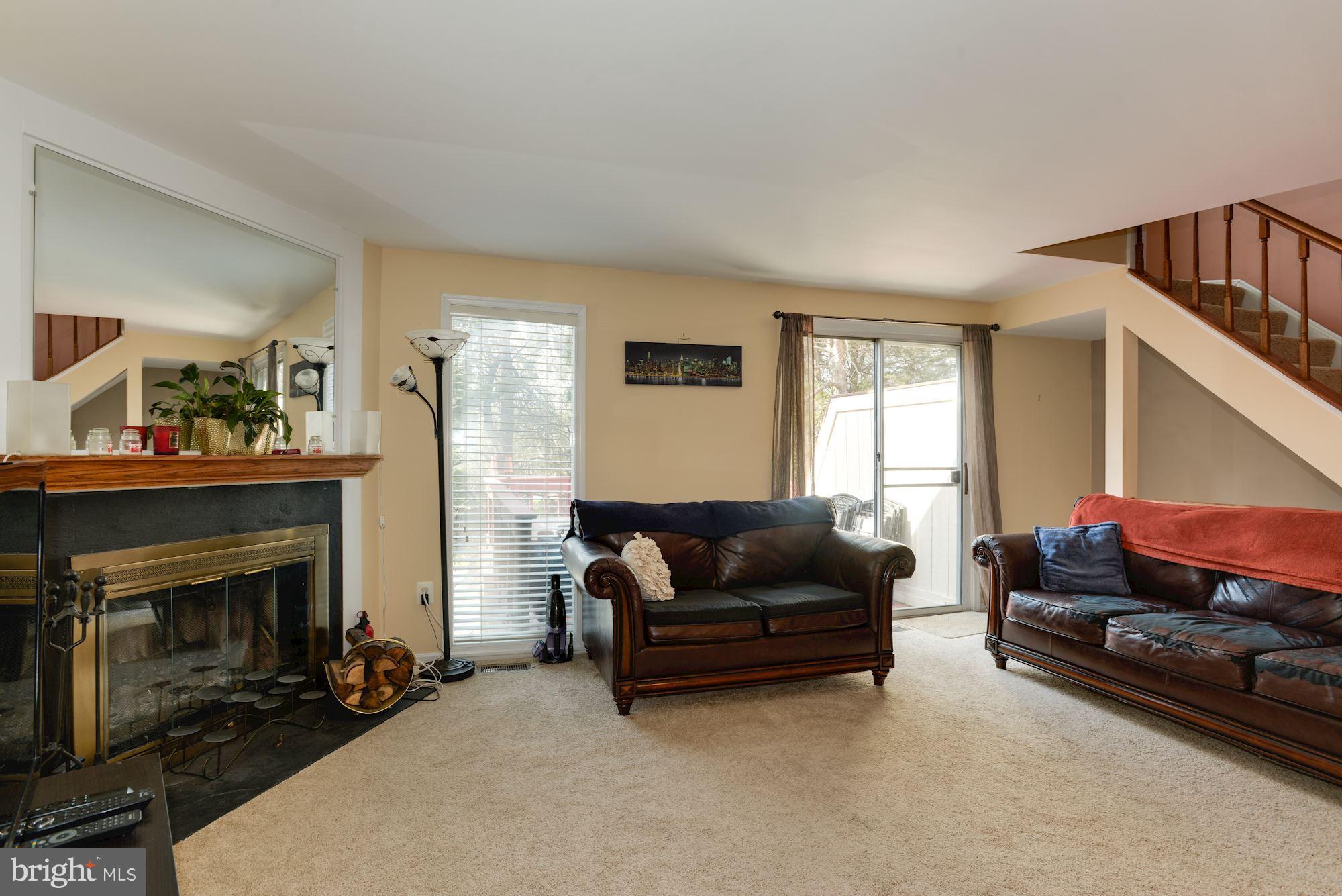 1704 Quietree Drive Reston, VA 20194 - Photo 12 of 23 a living room with furniture and a fireplace