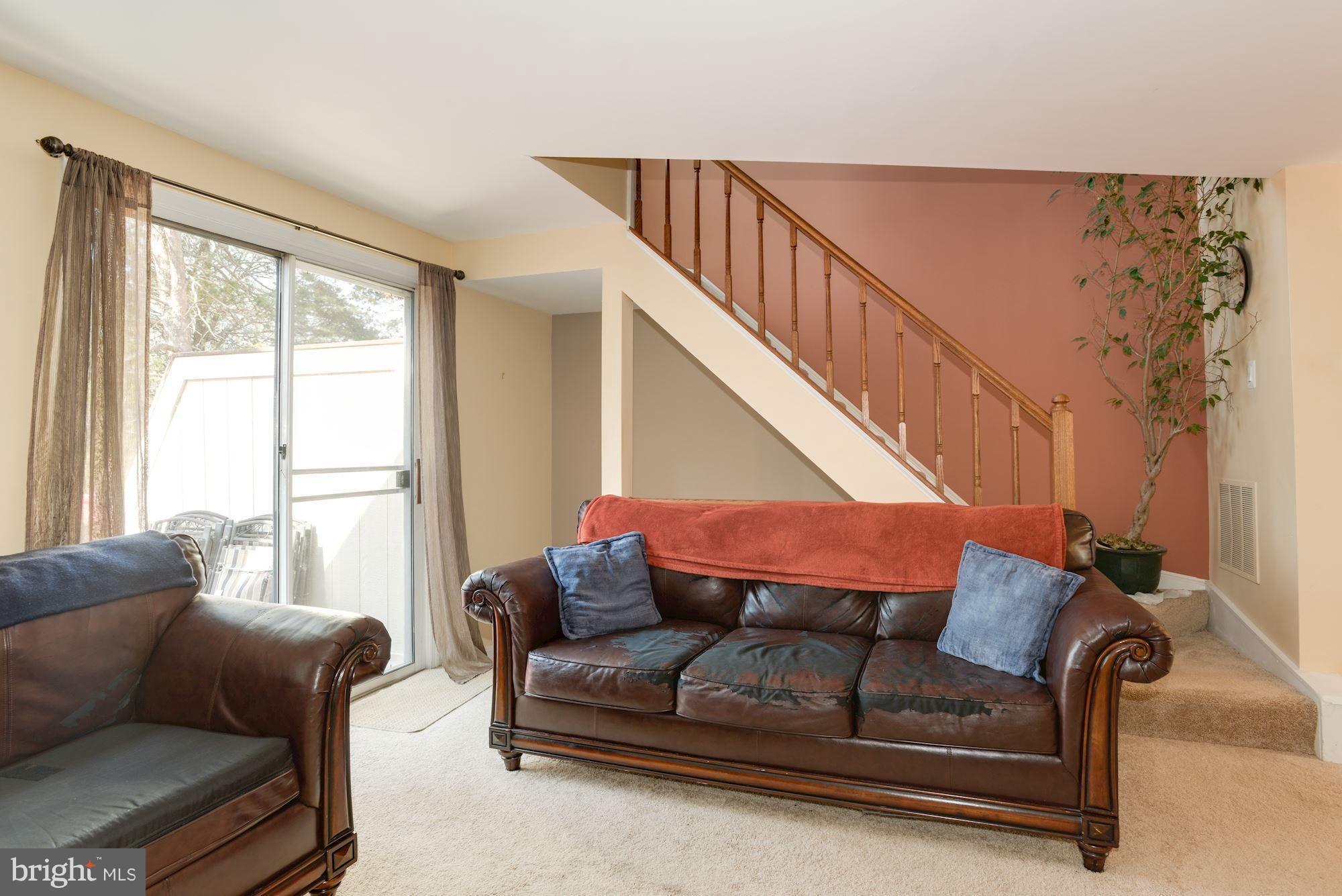 1704 Quietree Drive Reston, VA 20194 - Photo 13 of 23 a living room with furniture and a large window