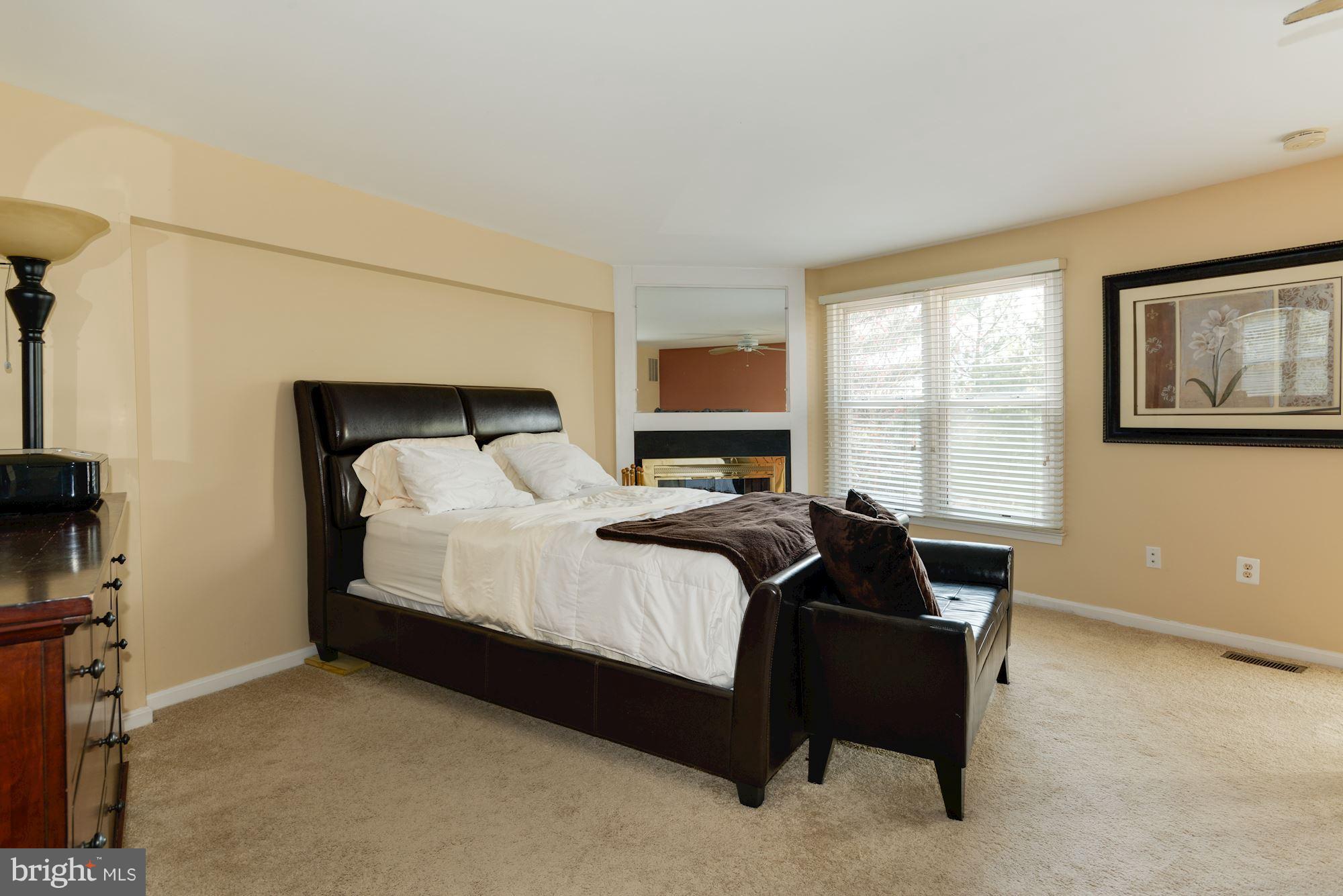 1704 Quietree Drive Reston, VA 20194 - Photo 16 of 23 a bedroom with a bed and a window