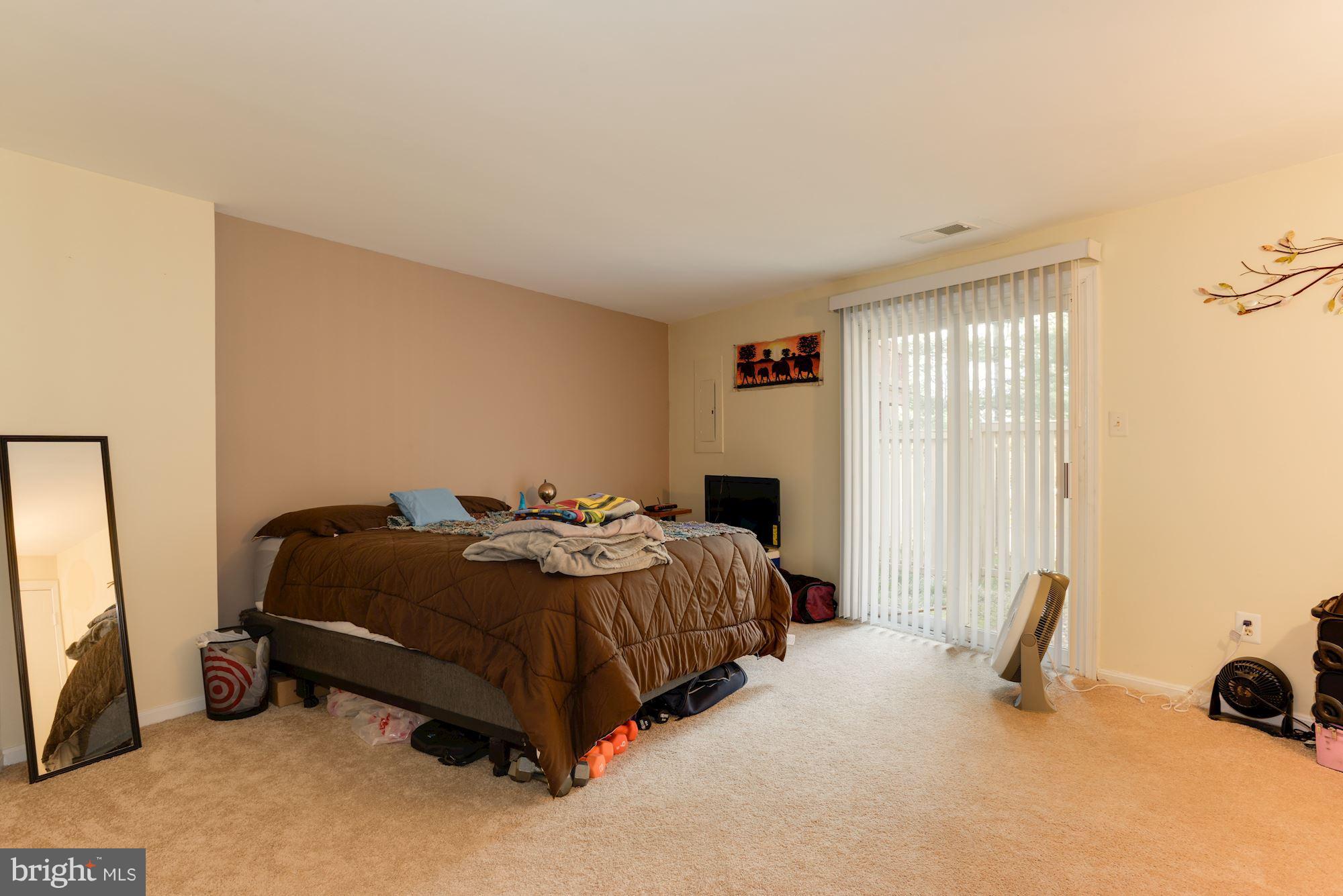 1704 Quietree Drive Reston, VA 20194 - Photo 21 of 23 a bedroom with a bed and a window
