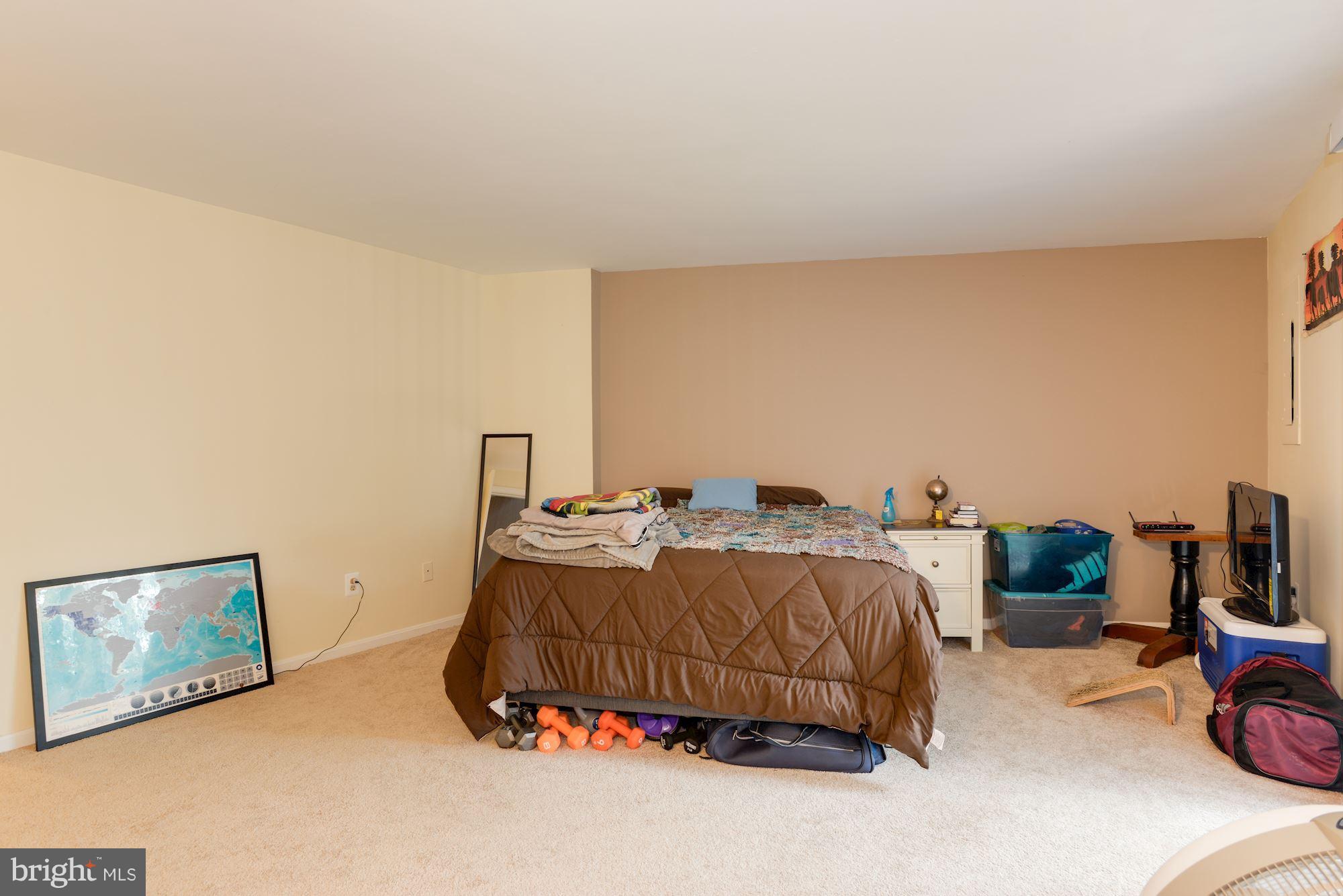 1704 Quietree Drive Reston, VA 20194 - Photo 22 of 23 a bedroom with a bed and dresser