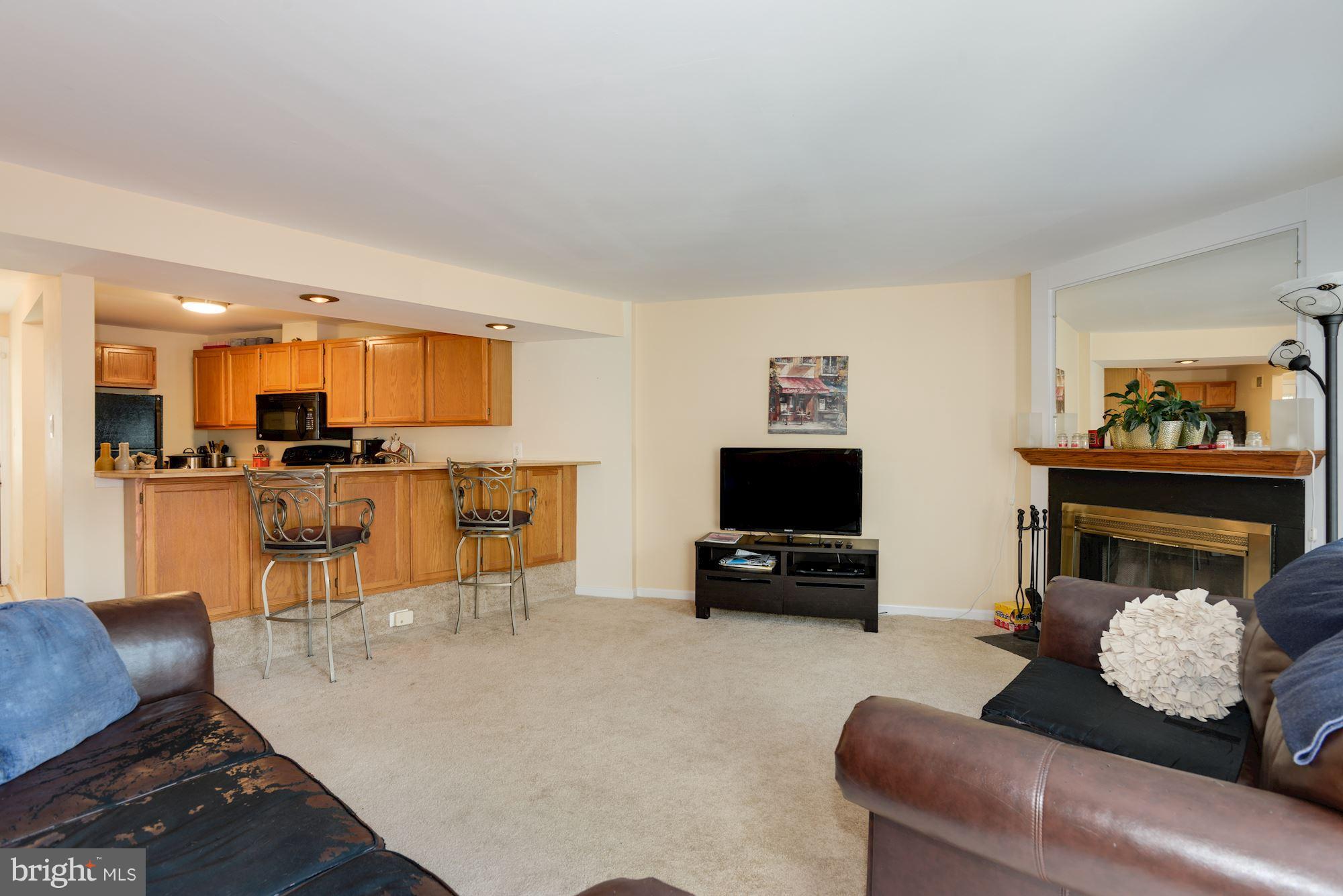 1704 Quietree Drive Reston, VA 20194 - Photo 9 of 23 a living room with furniture and a flat screen tv