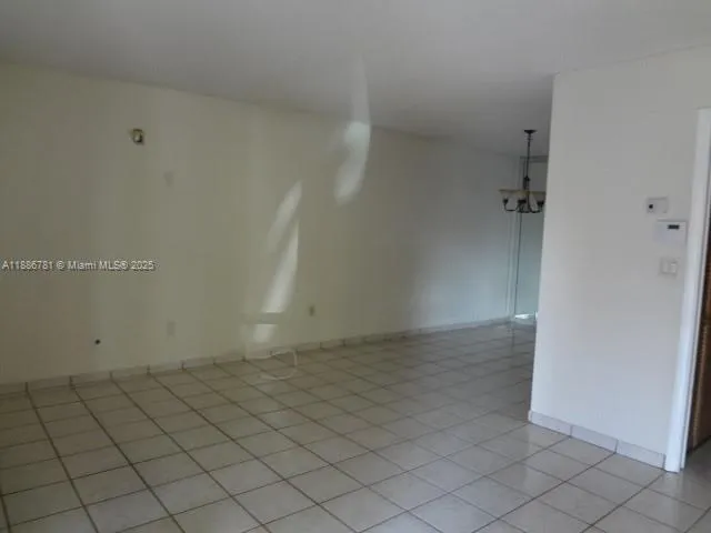 a view of a hallway to other room