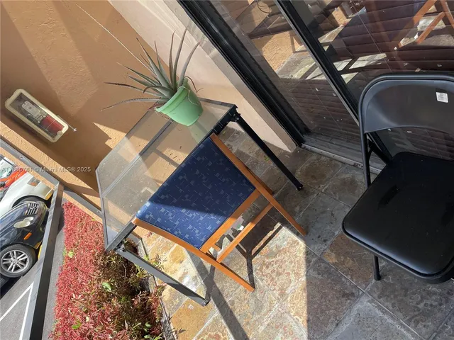a kitchen with white cabinets and appliances