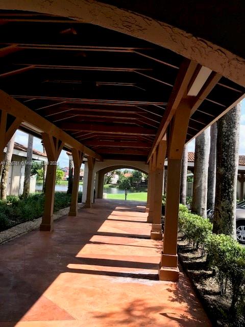 18216 Mediterranean Boulevard, Unit 119 Hialeah, FL 33015 - Photo 10 of 42 a view of a porch