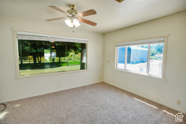 2373 East 190 North Beaver, UT 84713 - Photo 18 of 54 Carpeted spare room with baseboards and ceiling fan