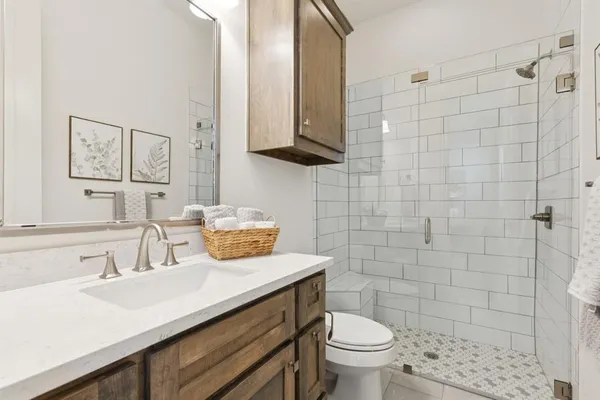 an empty room with a window and a ceiling fan