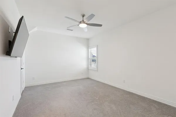 a view of a livingroom with furniture and a flat screen tv