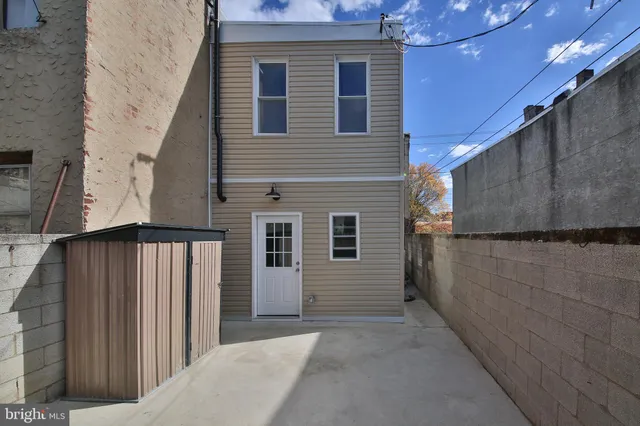 a view of entrance gate of building and chandelier
