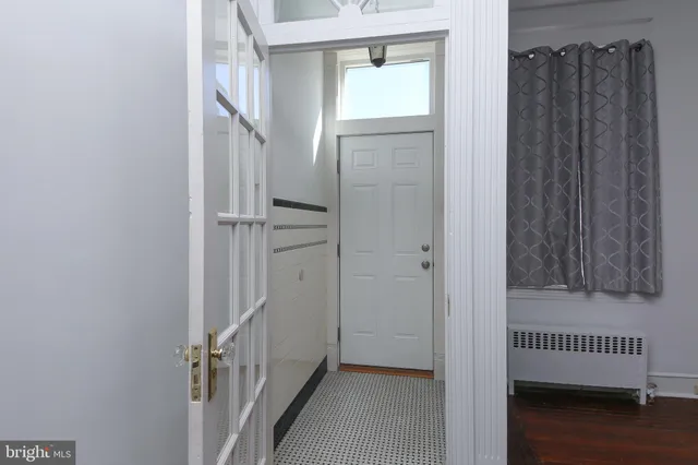 a view of hallway with wooden floor