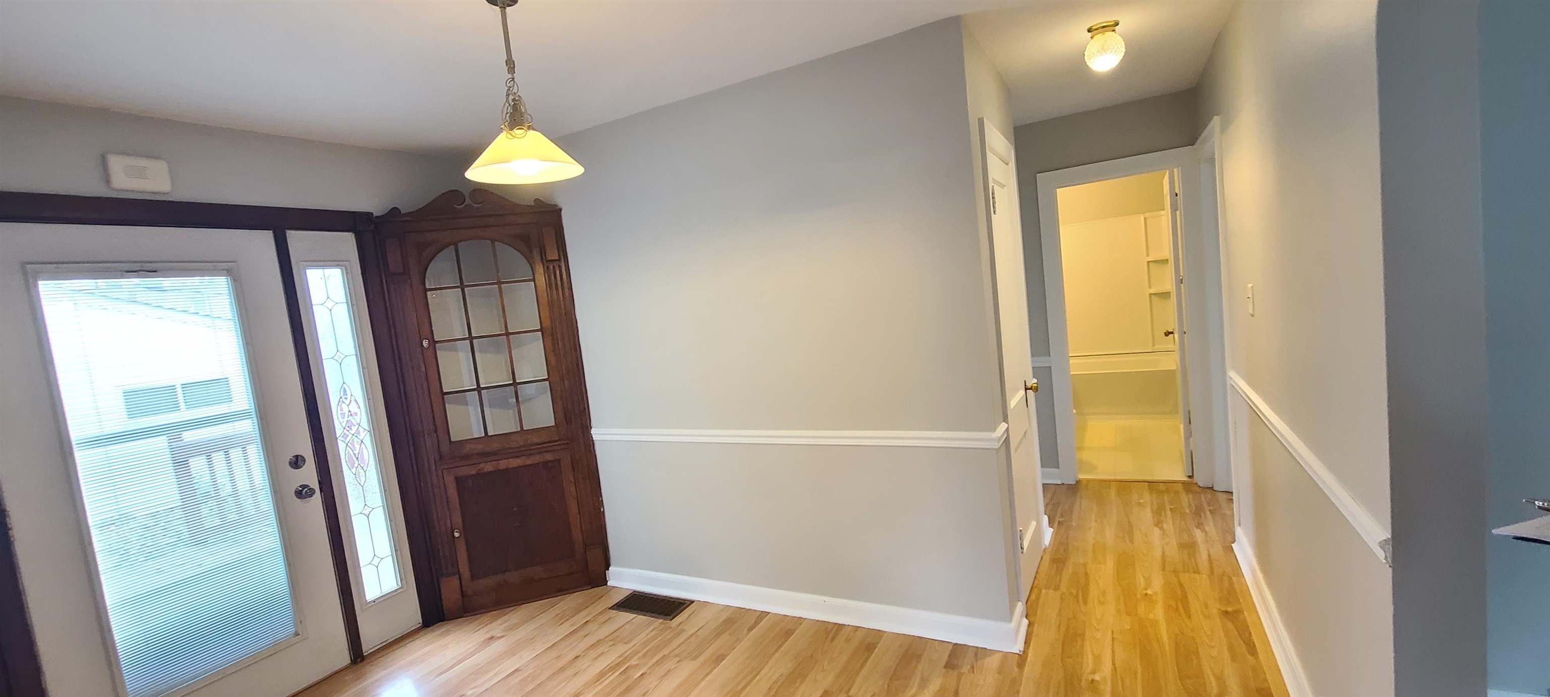 312 North 12th Street Rochelle, IL 61068 - Photo 11 of 25 a view of empty room with wooden floor and fan