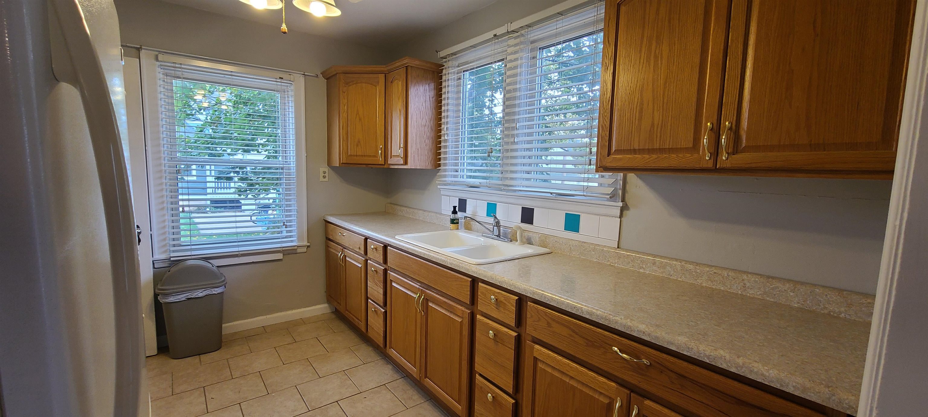 312 North 12th Street Rochelle, IL 61068 - Photo 2 of 25 a kitchen with stainless steel appliances granite countertop a sink stove and cabinets