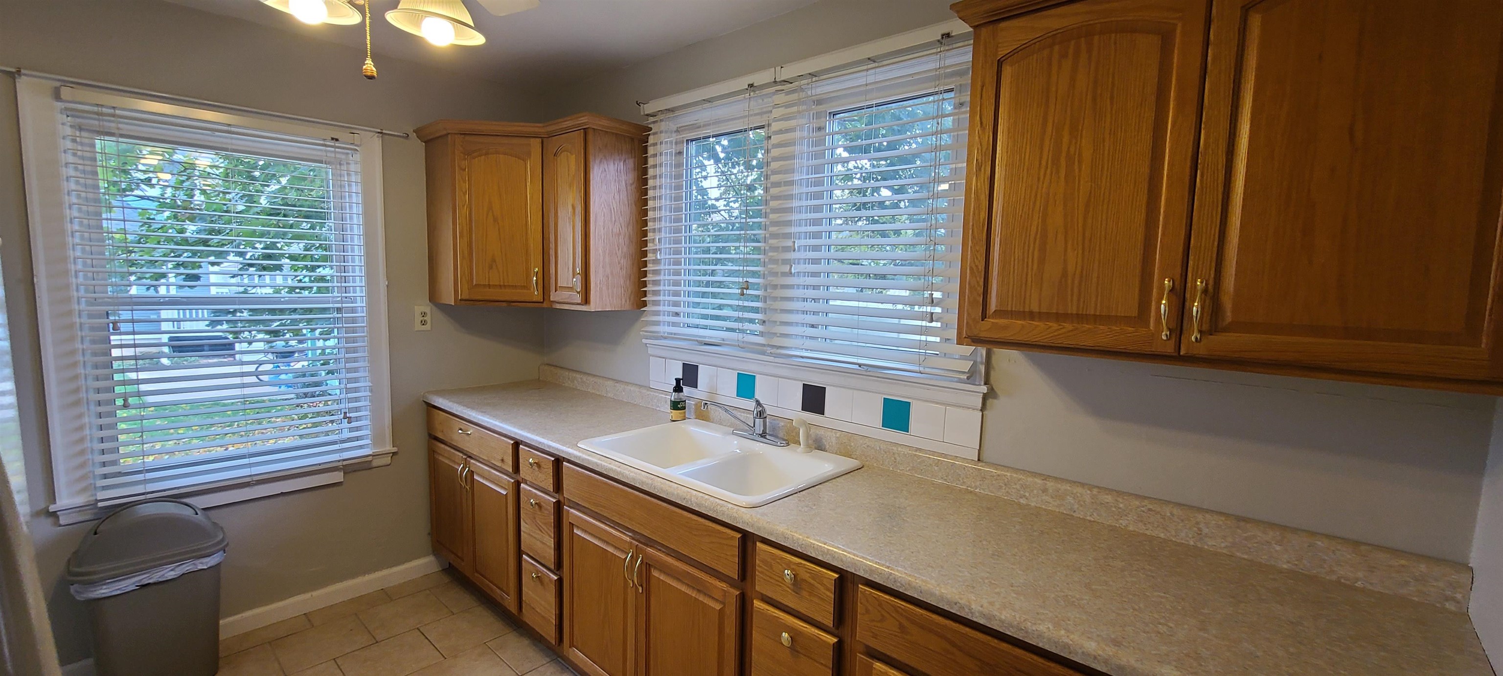 312 North 12th Street Rochelle, IL 61068 - Photo 4 of 25 a kitchen with a sink and a window