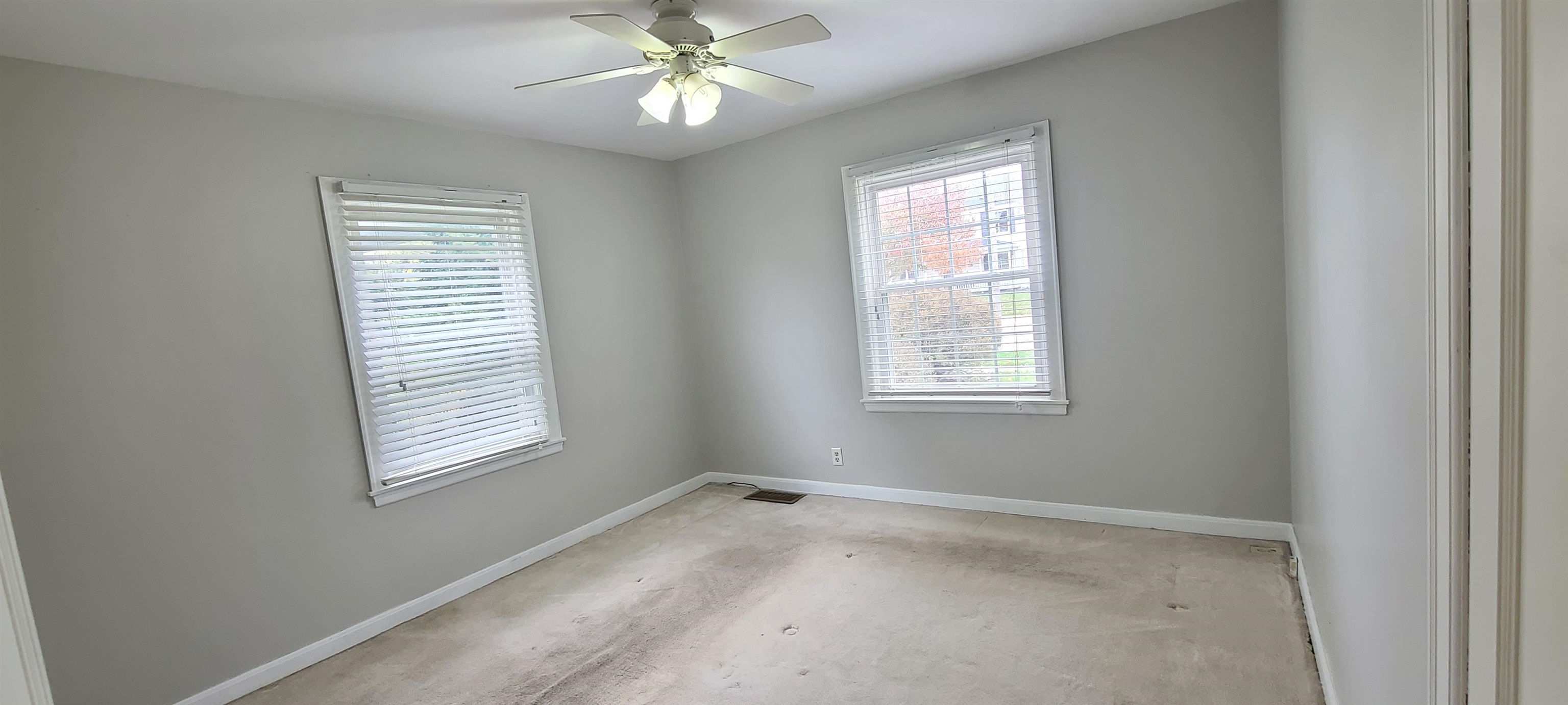 312 North 12th Street Rochelle, IL 61068 - Photo 7 of 25 a view of a livingroom with a ceiling fan and window