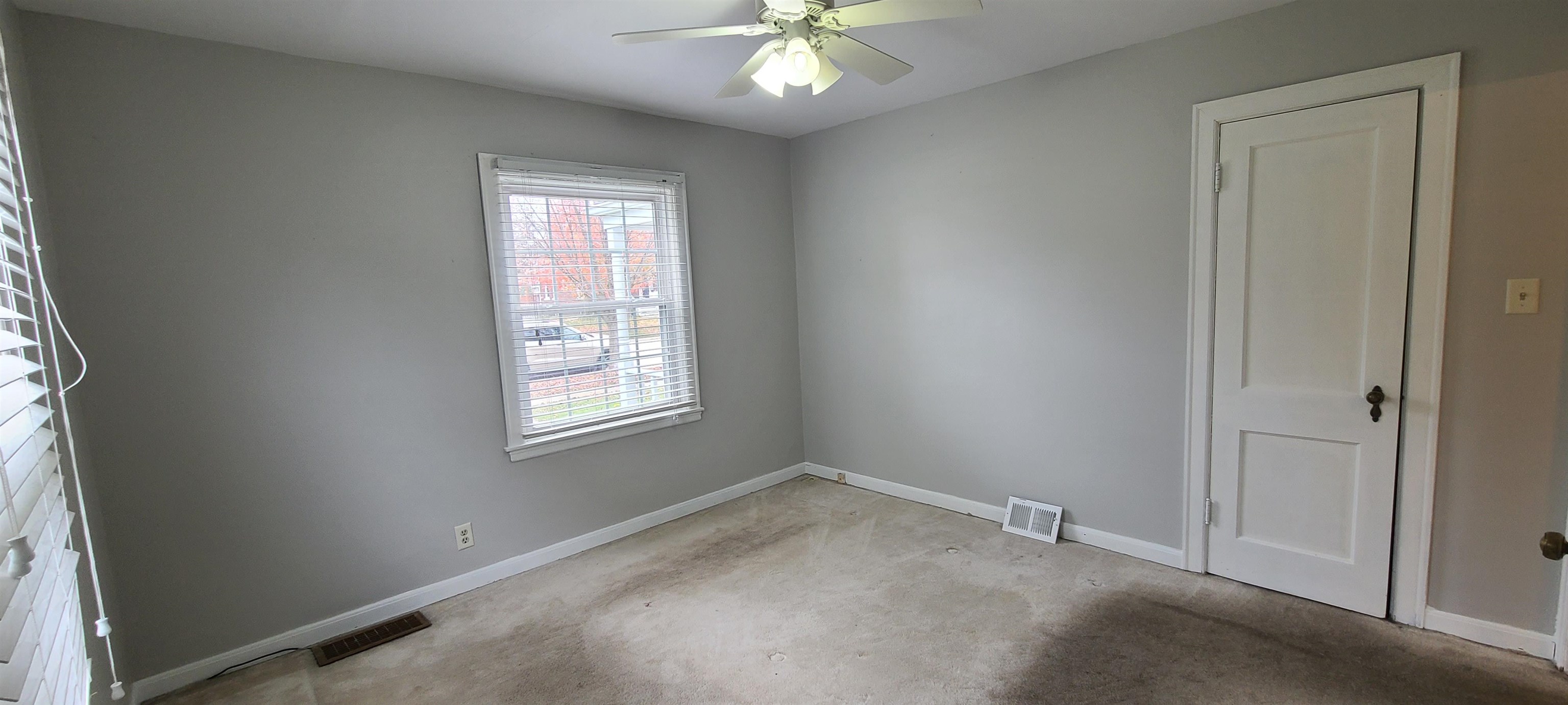 312 North 12th Street Rochelle, IL 61068 - Photo 8 of 25 an empty room with a window