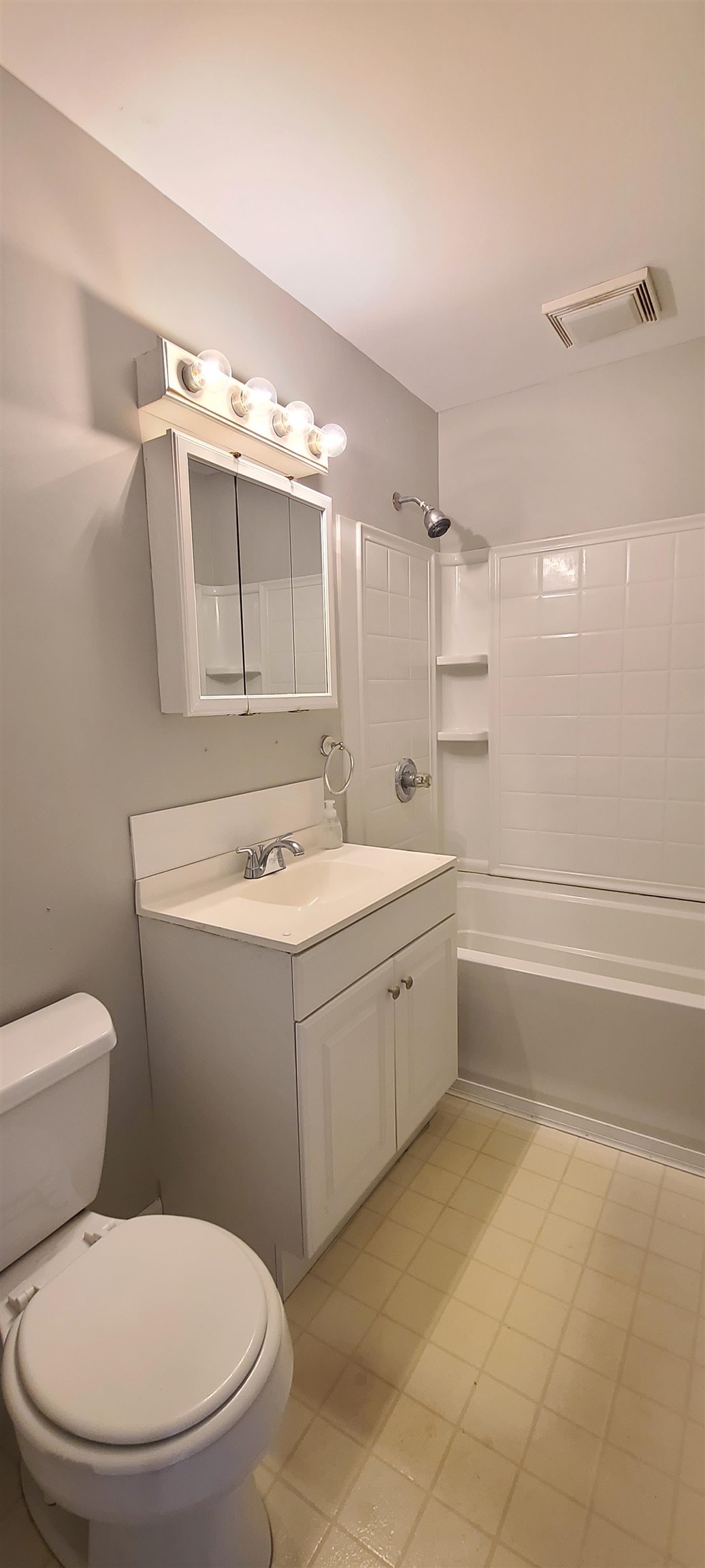 312 North 12th Street Rochelle, IL 61068 - Photo 9 of 25 a bathroom with a toilet sink and mirror