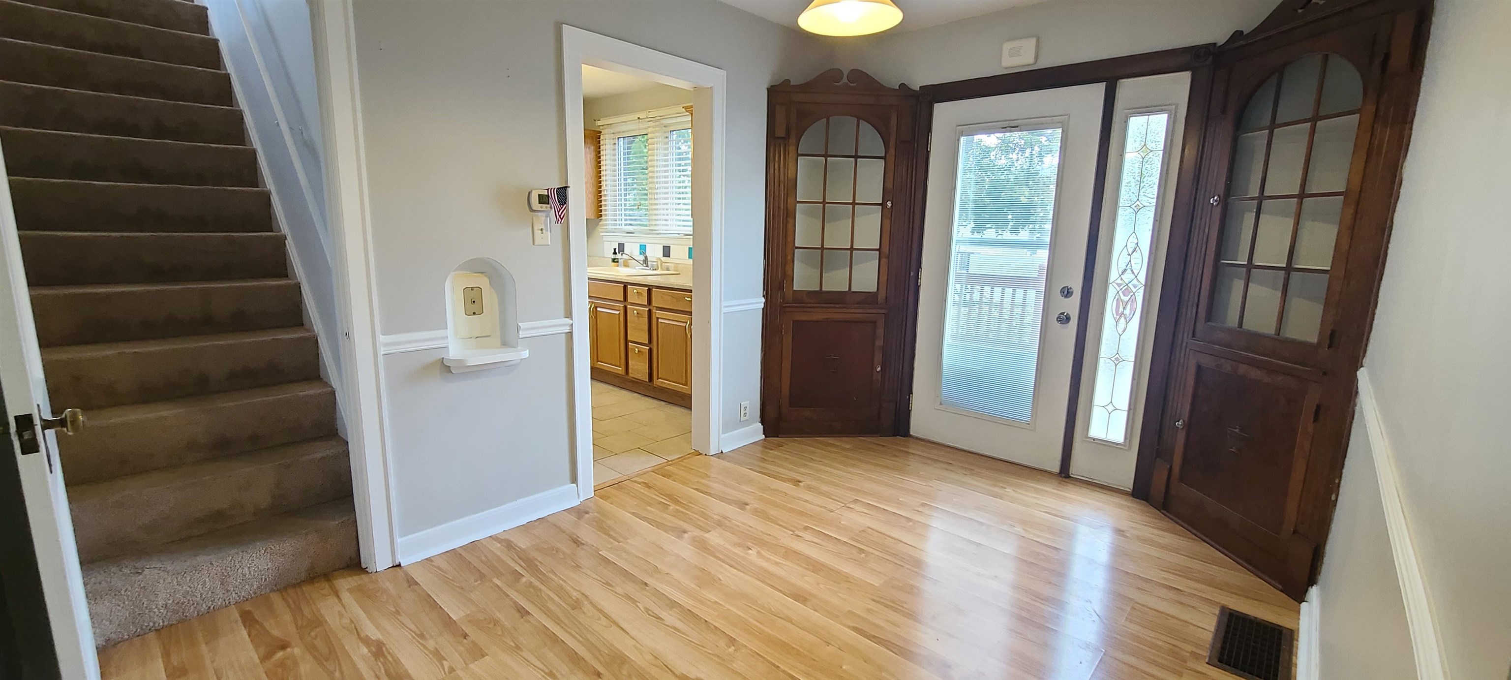 312 North 12th Street Rochelle, IL 61068 - Photo 10 of 25 a view of an empty room with wooden floor and windows