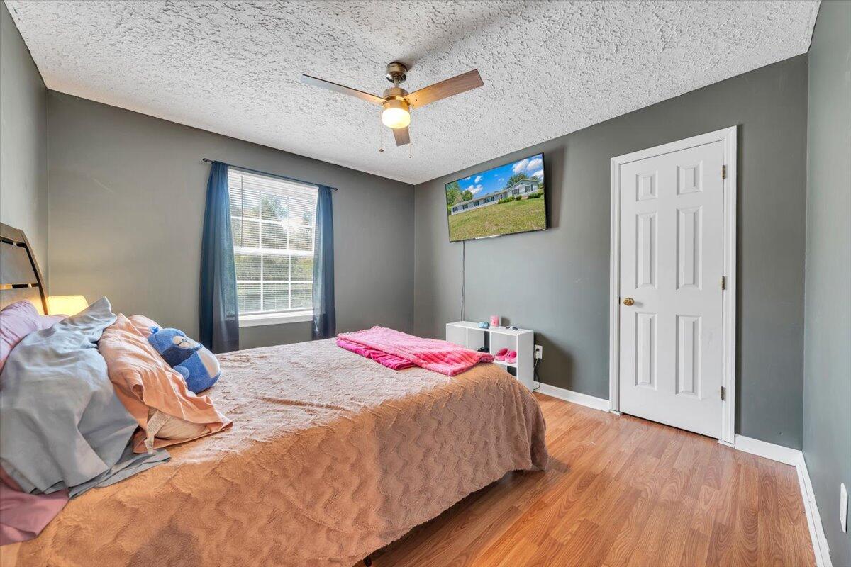 3870 Goose Dam Road Rocky Mount, VA 24151 - Photo 26 of 44 a bedroom with a bed and a chandelier