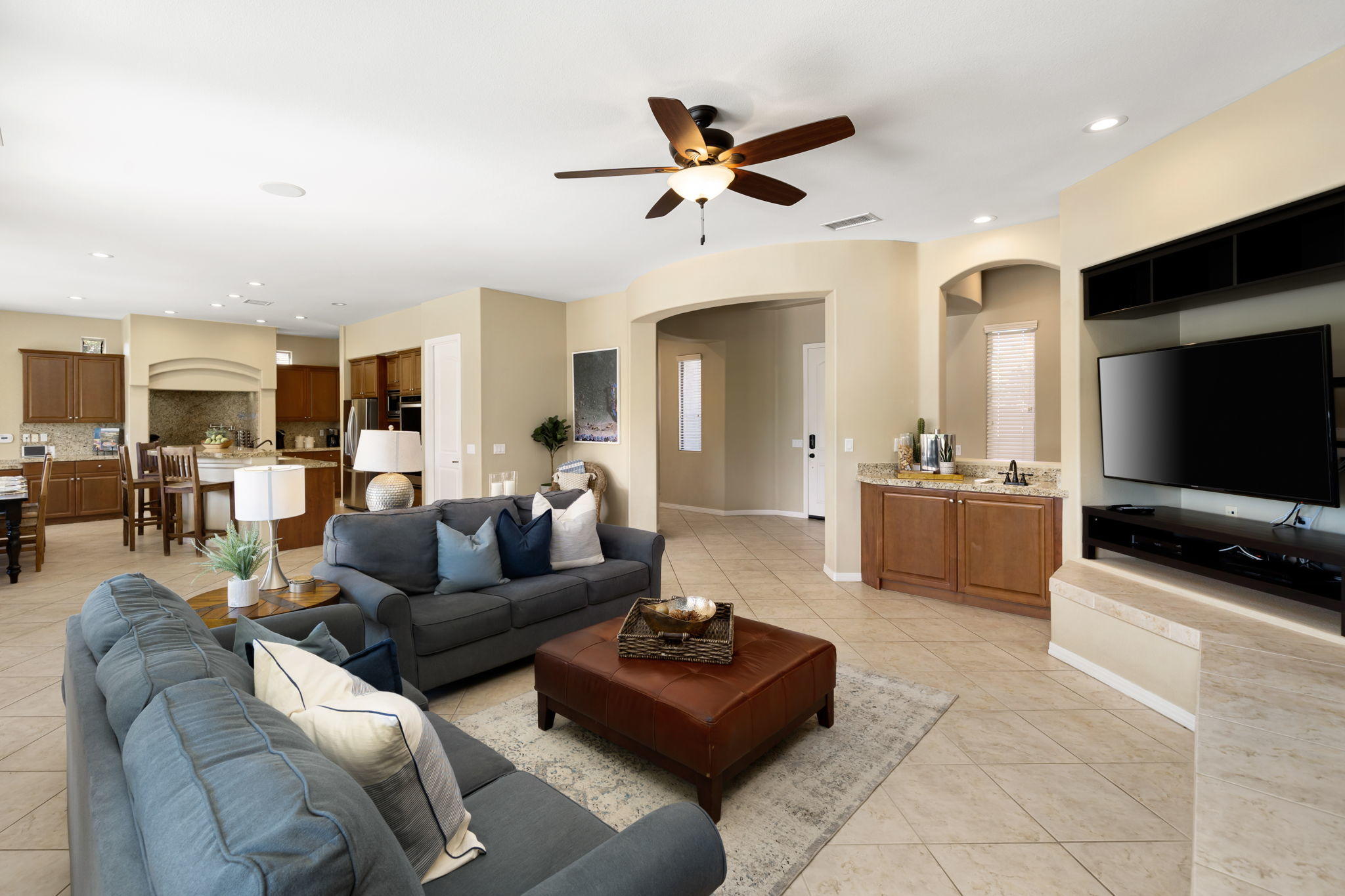 48640 Cascade Street Indio, CA 92201 - Photo 24 of 49 a living room with furniture and a flat screen tv