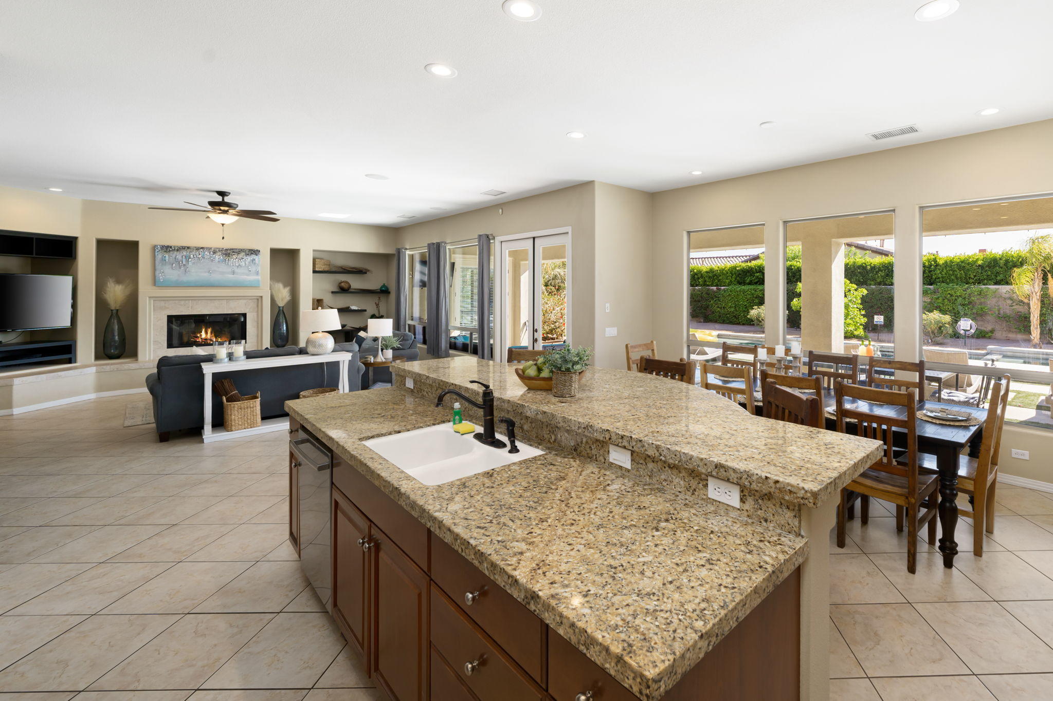 48640 Cascade Street Indio, CA 92201 - Photo 27 of 49 a kitchen with stainless steel appliances granite countertop sink stove and refrigerator