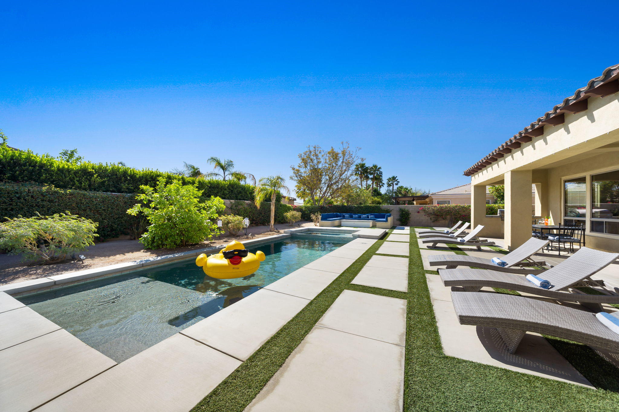 48640 Cascade Street Indio, CA 92201 - Photo 4 of 49 a swimming pool with outdoor seating and yard