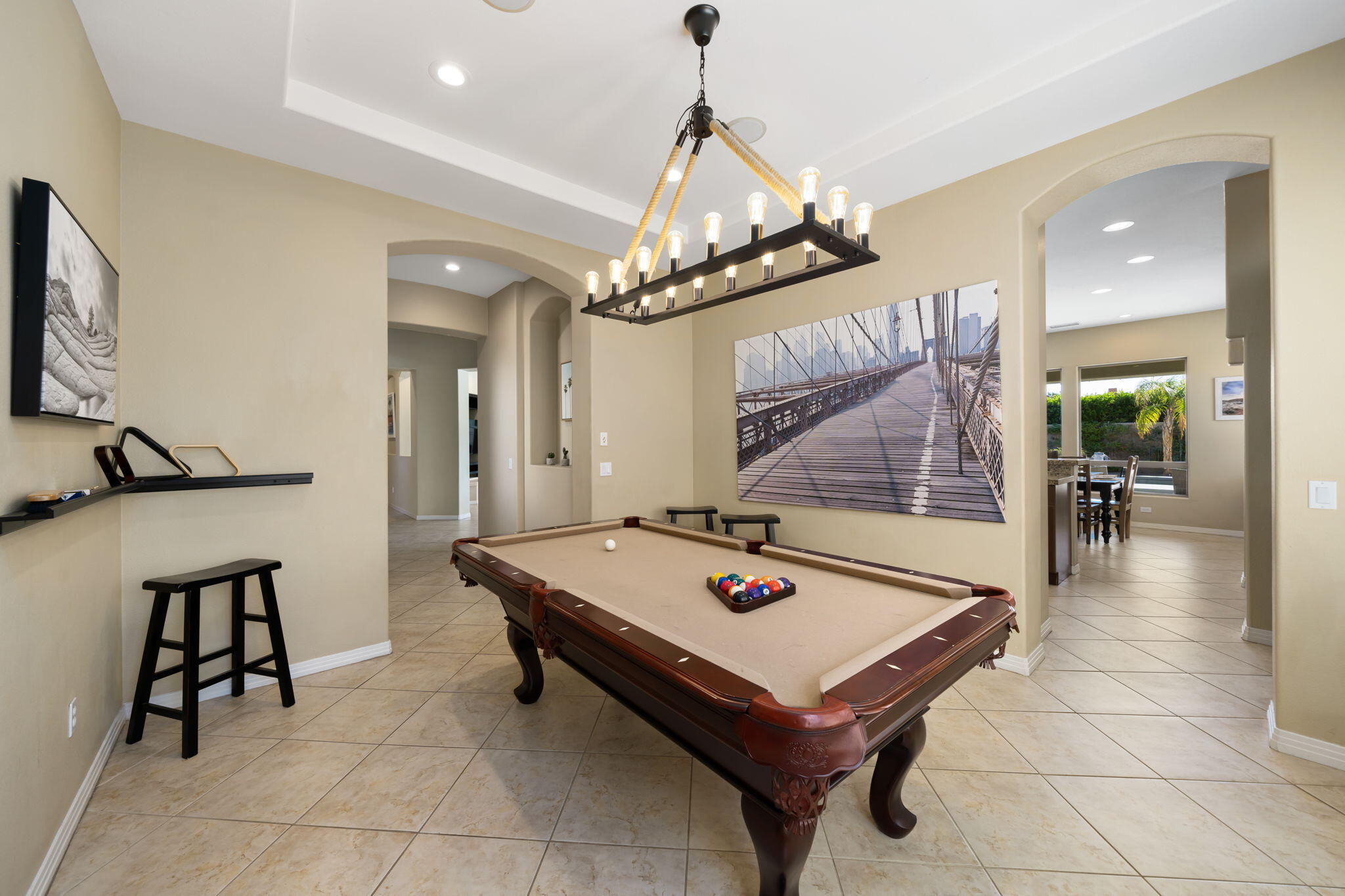 48640 Cascade Street Indio, CA 92201 - Photo 32 of 49 a room with pool table and glass windows