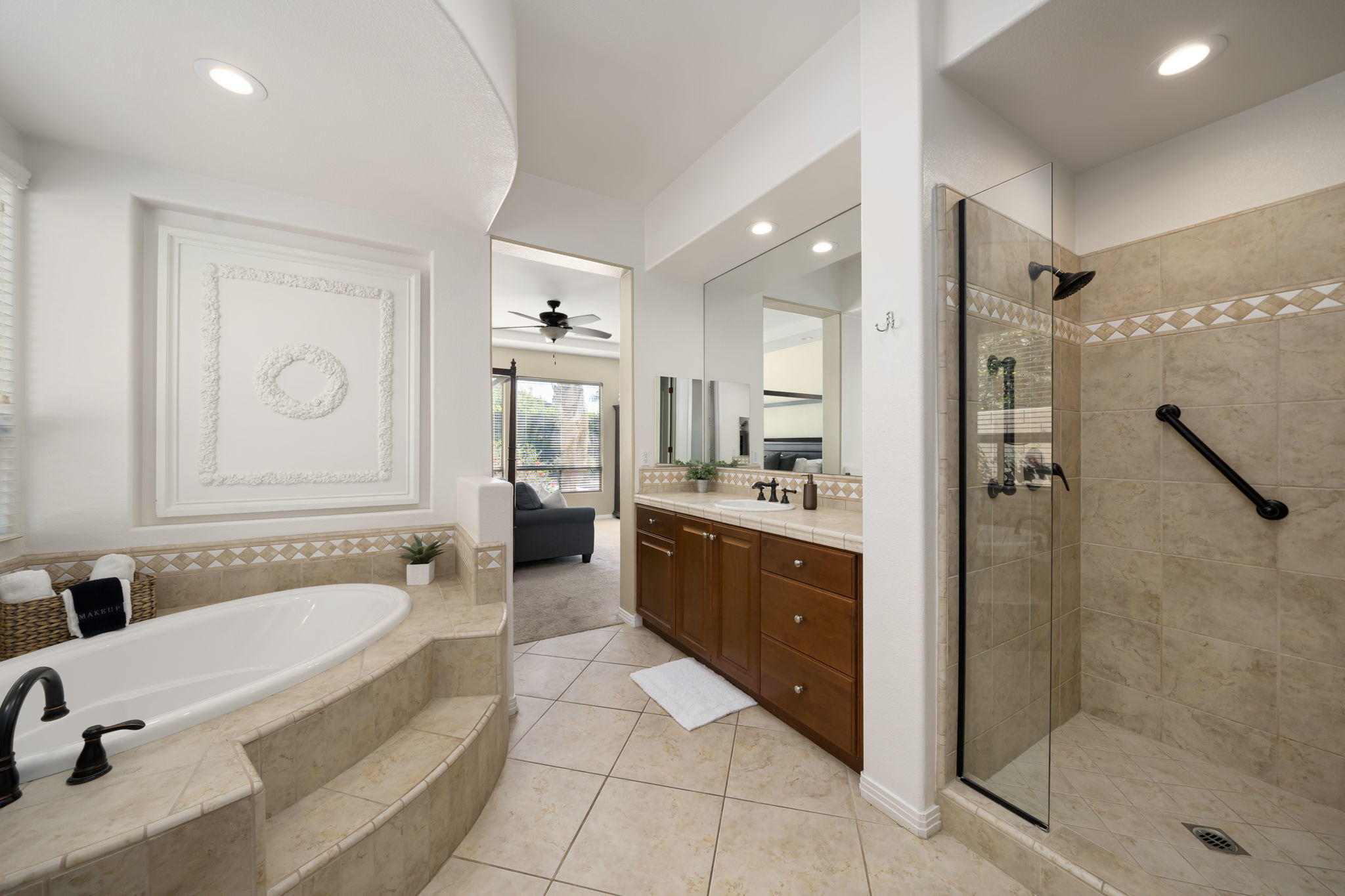 48640 Cascade Street Indio, CA 92201 - Photo 38 of 49 a spacious bathroom with a tub shower and mirror