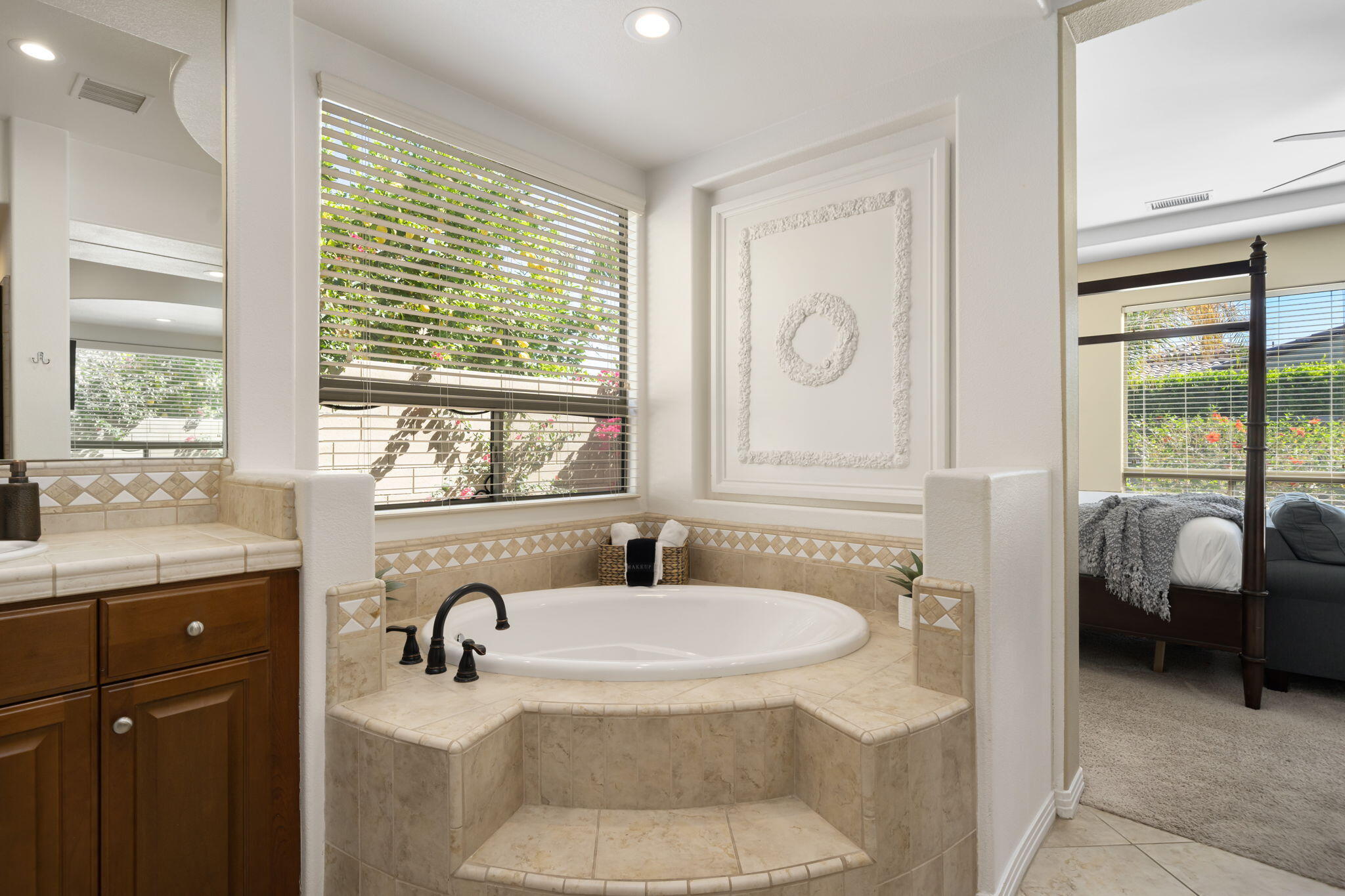 48640 Cascade Street Indio, CA 92201 - Photo 39 of 49 a bathroom with a tub sink and mirror