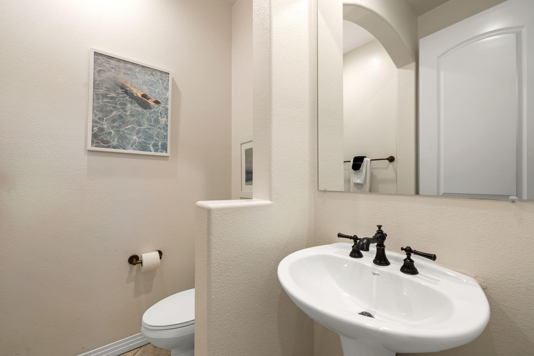 48640 Cascade Street Indio, CA 92201 - Photo 46 of 49 a bathroom with a toilet a sink and mirror