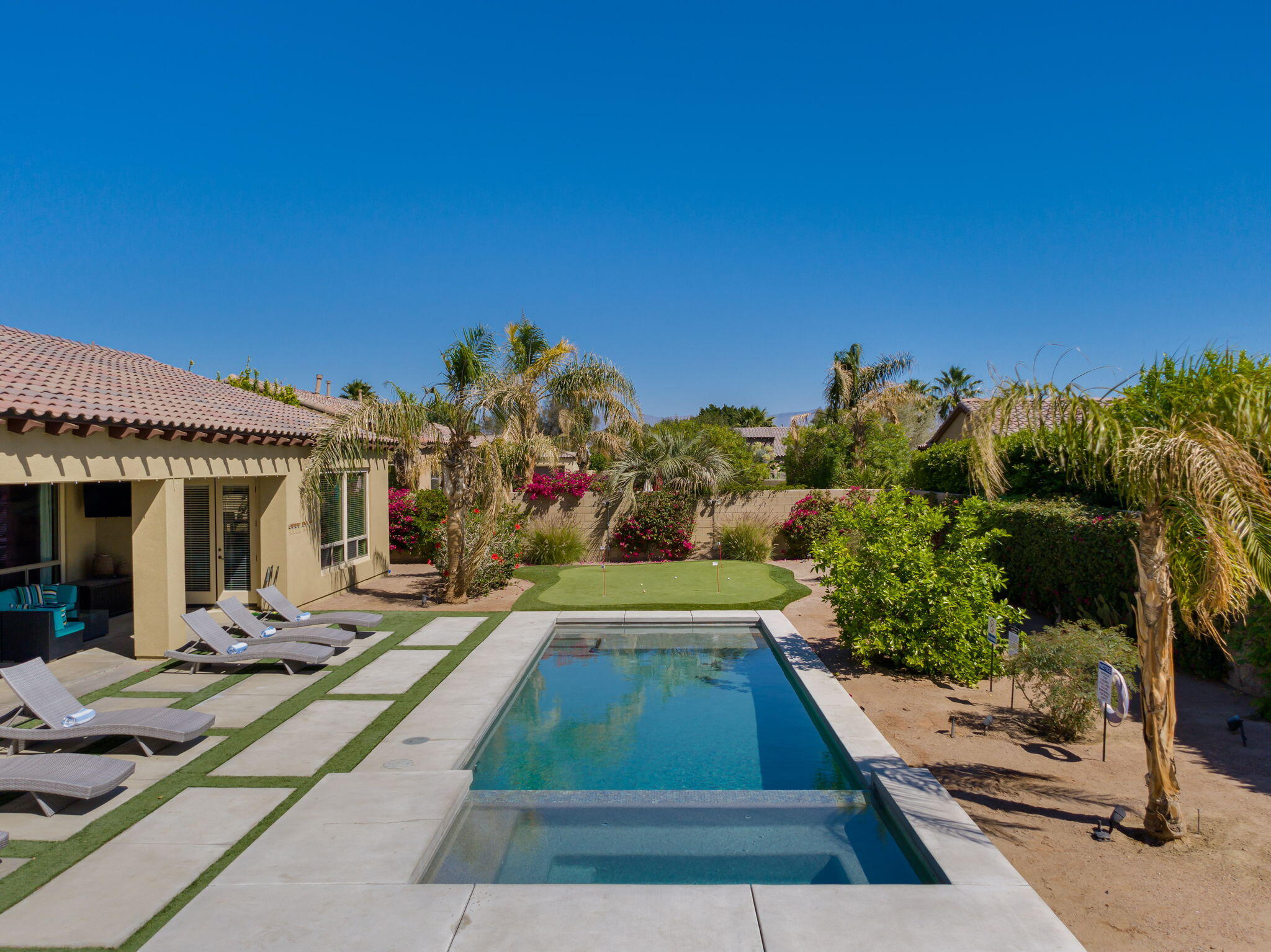 48640 Cascade Street Indio, CA 92201 - Photo 47 of 49 a view of a house with many windows