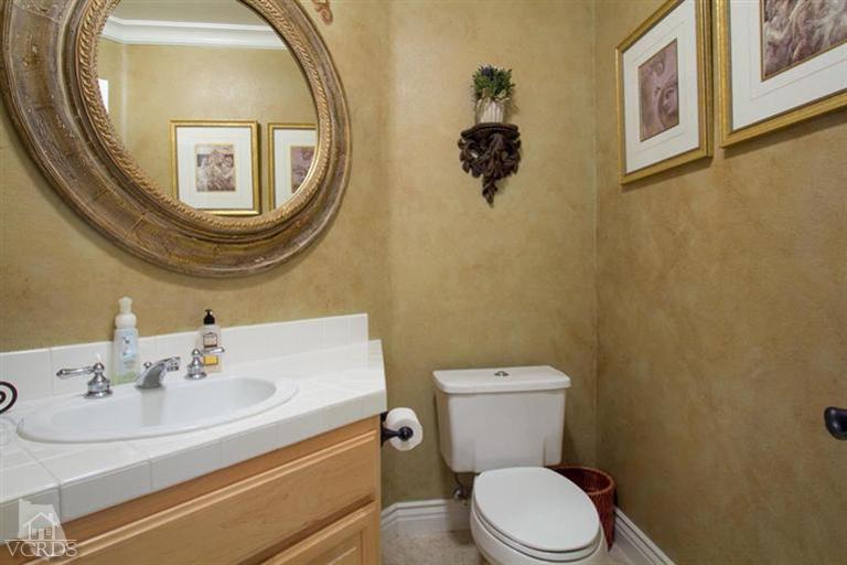 11210 Bentcreek Road Moorpark, CA 93021 - Photo 11 of 22 a bathroom with a toilet sink and mirror