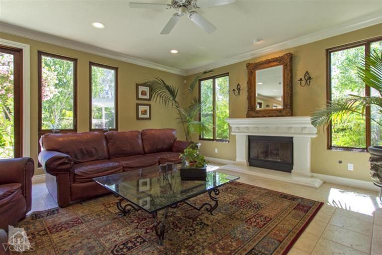 11210 Bentcreek Road Moorpark, CA 93021 - Photo 12 of 22 a living room with furniture and a fireplace