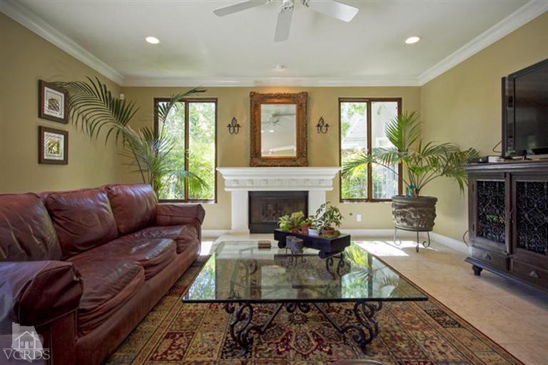 11210 Bentcreek Road Moorpark, CA 93021 - Photo 13 of 22 a living room with furniture a large window and a fireplace