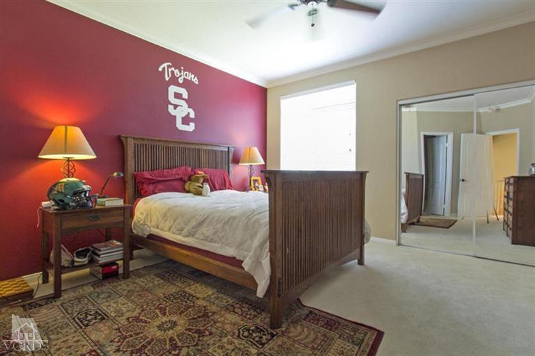 11210 Bentcreek Road Moorpark, CA 93021 - Photo 16 of 22 a bedroom with a bed and a lamp