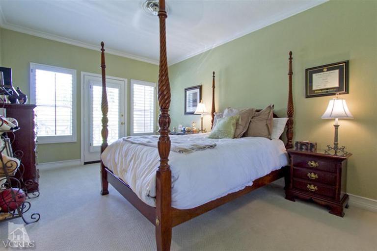 11210 Bentcreek Road Moorpark, CA 93021 - Photo 17 of 22 a bed room with a bed and a lamp